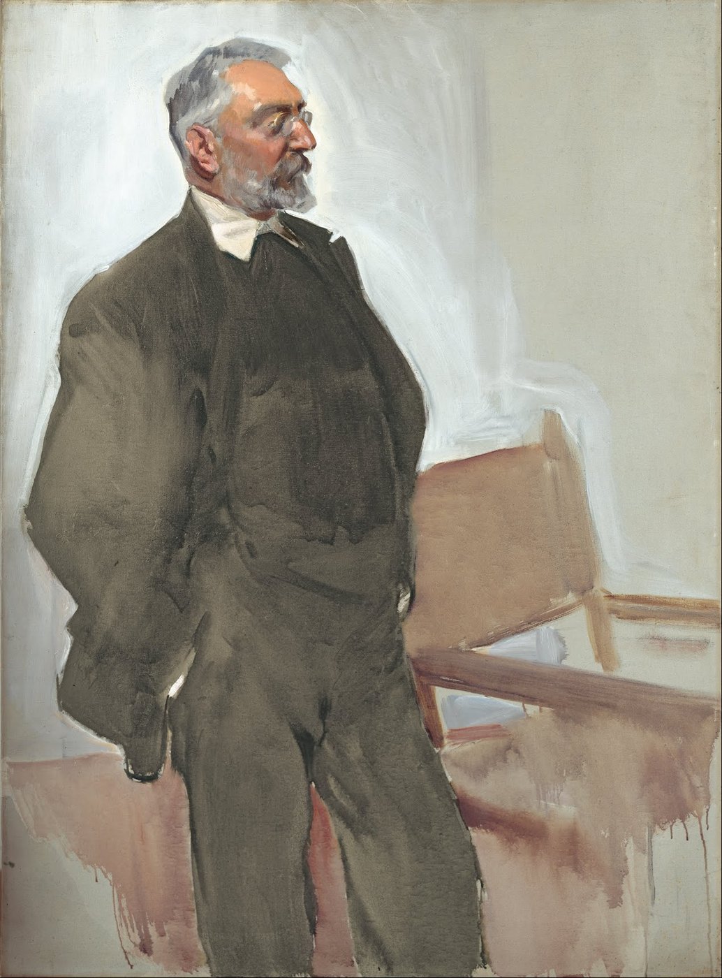 Retrato al óleo de Unamuno de pie, con barba gris, gafas redondas y traje oscuro